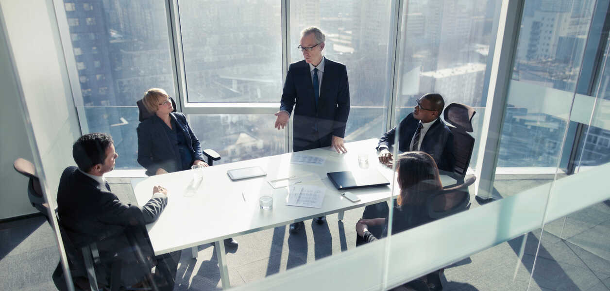 Businessman talking to colleagues in meeting