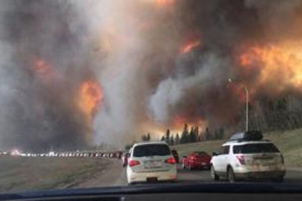 Cars driving away from Fort McMurray wildfires in November 2016