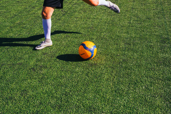 Person about to kick a soccer ball